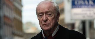 King Of Thieves Michael Caine looking dour on the streets of London