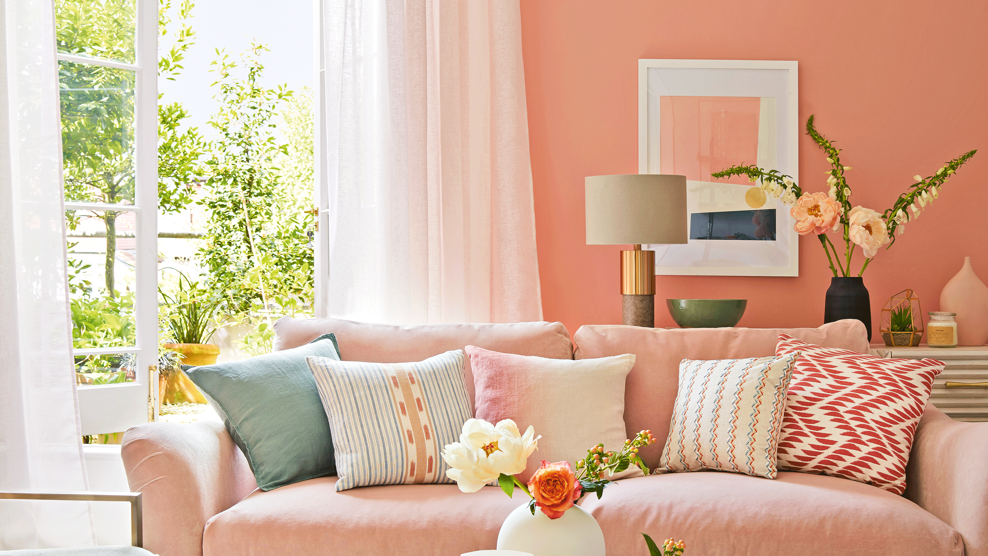 Pink living room with grey sofa