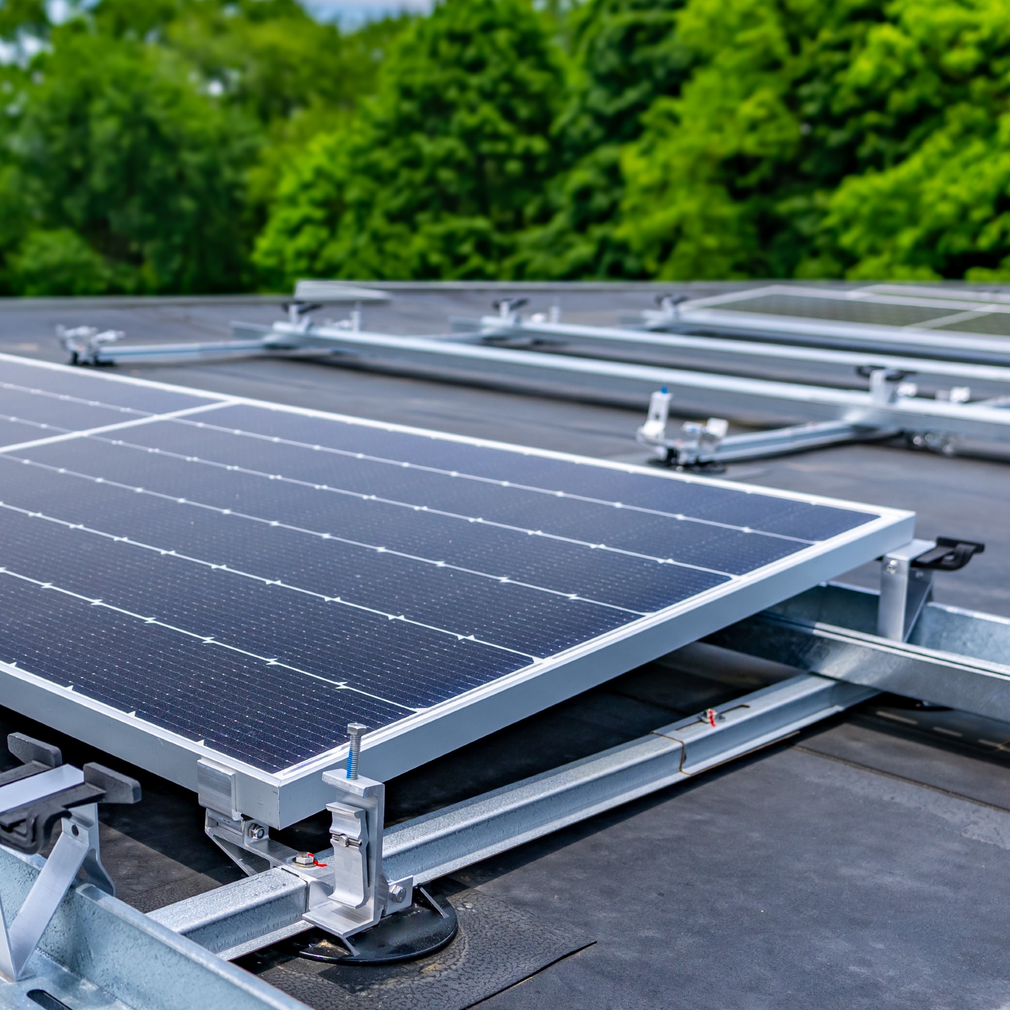 Solar panels on a flat roof with ballasts to angle them best
