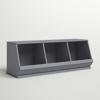 A grey storage bench with open storage underneath 