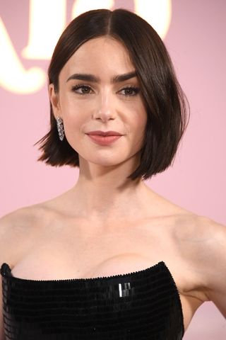 Lily Collins is seen with a monobrown-style bob at the Premiere Of Netflix's "Emily In Paris" Season 4 Part 1 at The Egyptian Theatre Hollywood on August 14, 2024 in Los Angeles, California.