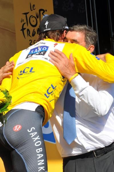 Race leader Fabian Cancellara is congratulated by Belgium's legendary Eddy Merckx.