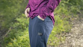 Man wearing Gore Fernflow shorts with hand in pocket