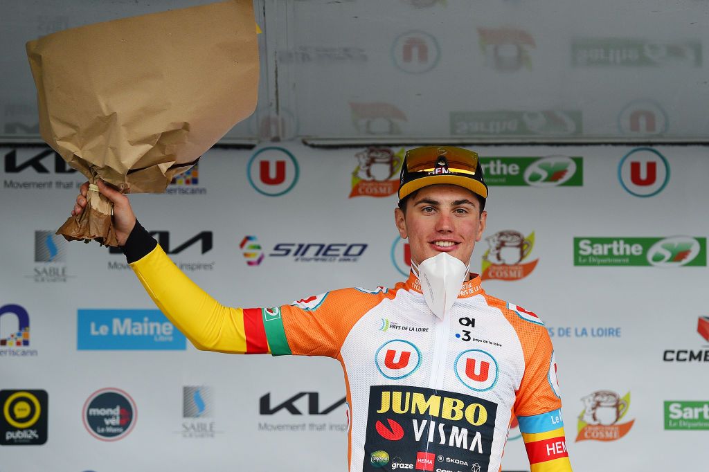 LE LUDE FRANCE APRIL 06 Olav Kooij of Netherlands and Team Jumbo Visma celebrates the orange stage winner jersey on the podium ceremony after the 68th Circuit Cycliste Sarthe Pays de la Loire 2022 Stage 2 a 1747km stage from Le Lude to Le Lude CircuitSarthe on April 06 2022 in Le Lude France Photo by Dario BelingheriGetty Images