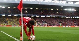 Liverpool right-back Trent Alexander-Arnold places the ball on the corner during the UEFA Champions League Semi Final Leg One match between Liverpool and Villarreal at Anfield on April 27, 2022 in Liverpool, England. 