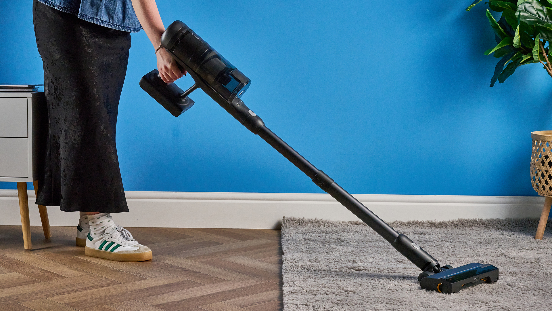 Roborock H60 Hub Ultra photograped in front f a blue background