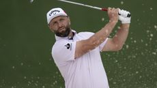 Jon Rahm pictured after hitting a shot at the 2026 Masters at Augusta National in a practice round