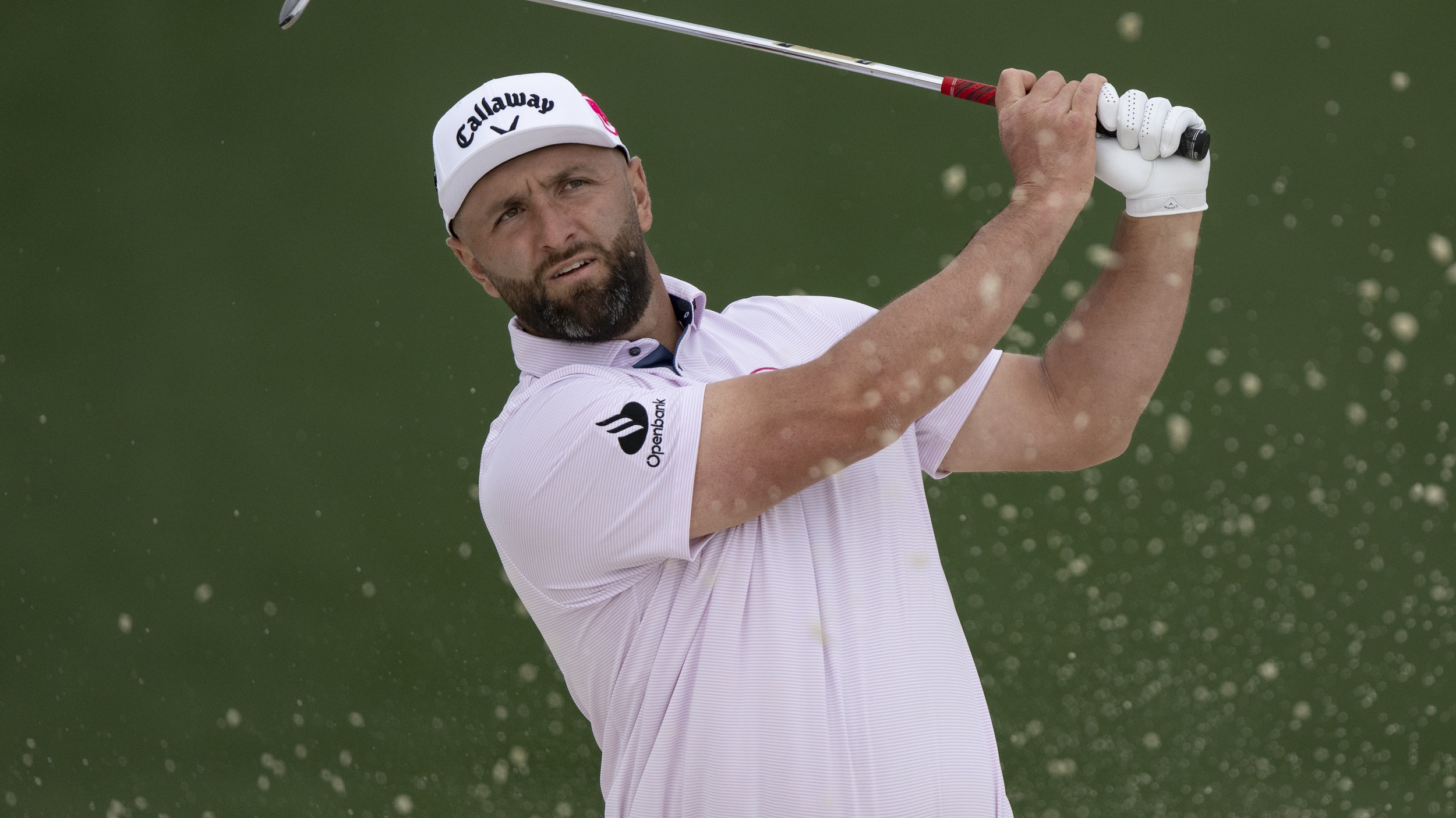 Jon Rahm pictured after hitting a shot at the 2026 Masters at Augusta National in a practice round