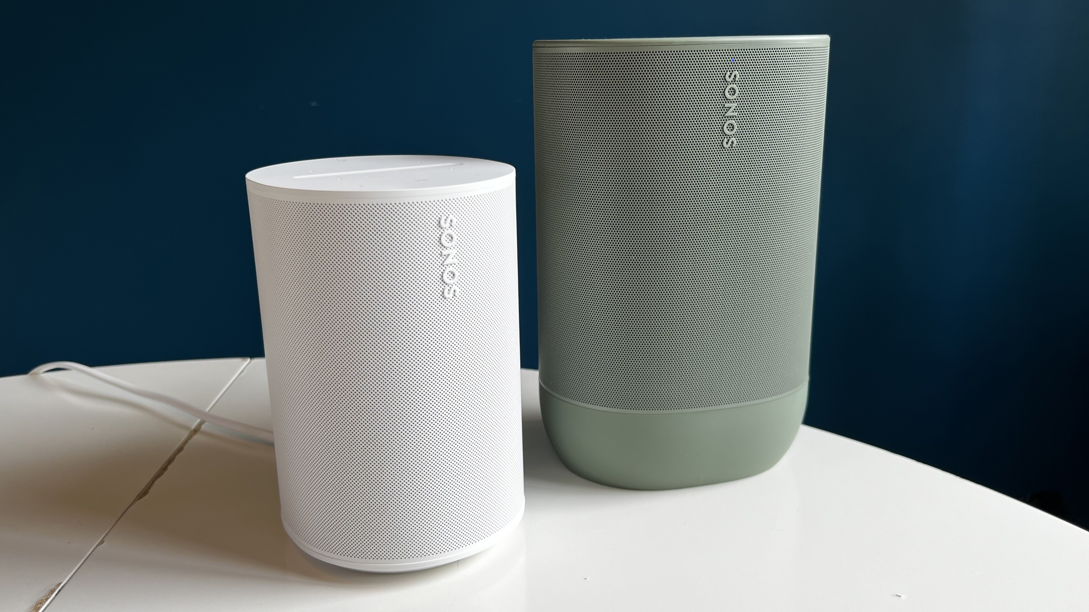 The Sonos Move 2 next to the Sonos era 100, showing how much smaller the Era 100 is