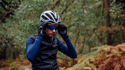 Image shows a rider wearing some of the best cycling sunglasses.