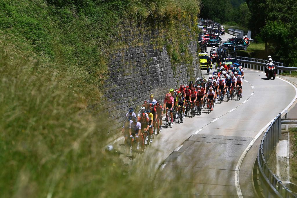 MALBUM SWITZERLAND JUNE 18 Jakob Fuglsang of Denmark and Team Israel Premier Tech Yellow Leader Jersey and a general view of the peloton competing during the 85th Tour de Suisse 2022 Stage 7 a 1946km stage from Ambri to Malbun 1560m tourdesuisse2022 WorldTour on June 18 2022 in Malbun Switzerland Photo by Tim de WaeleGetty Images