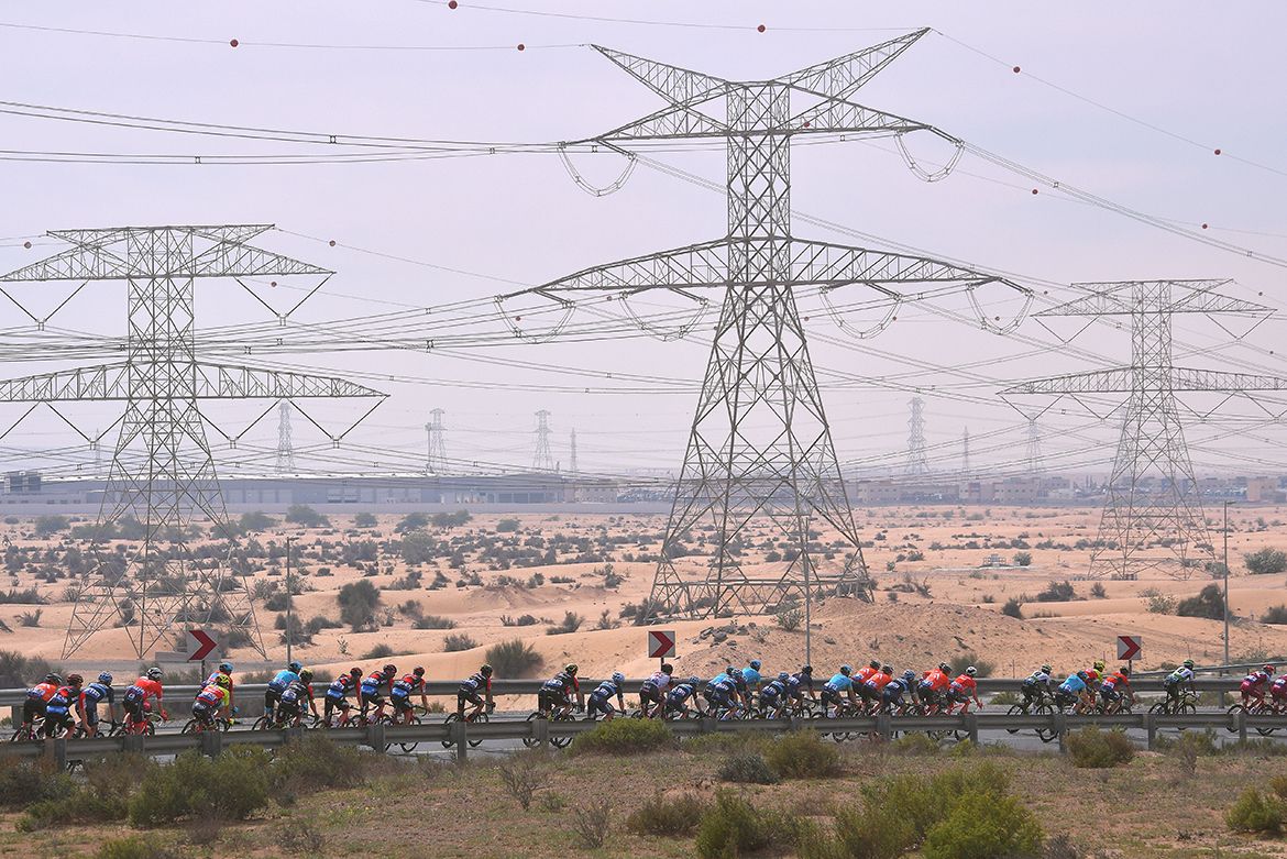 The peloton rides through the desert