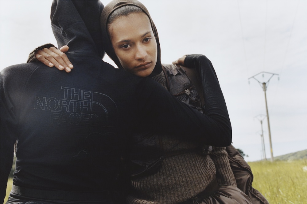 two models wearing cecilie bahnsen x the north face hoods in a field