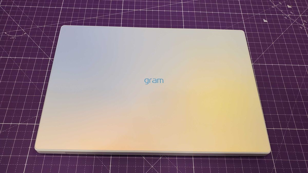 white laptop sitting on desk