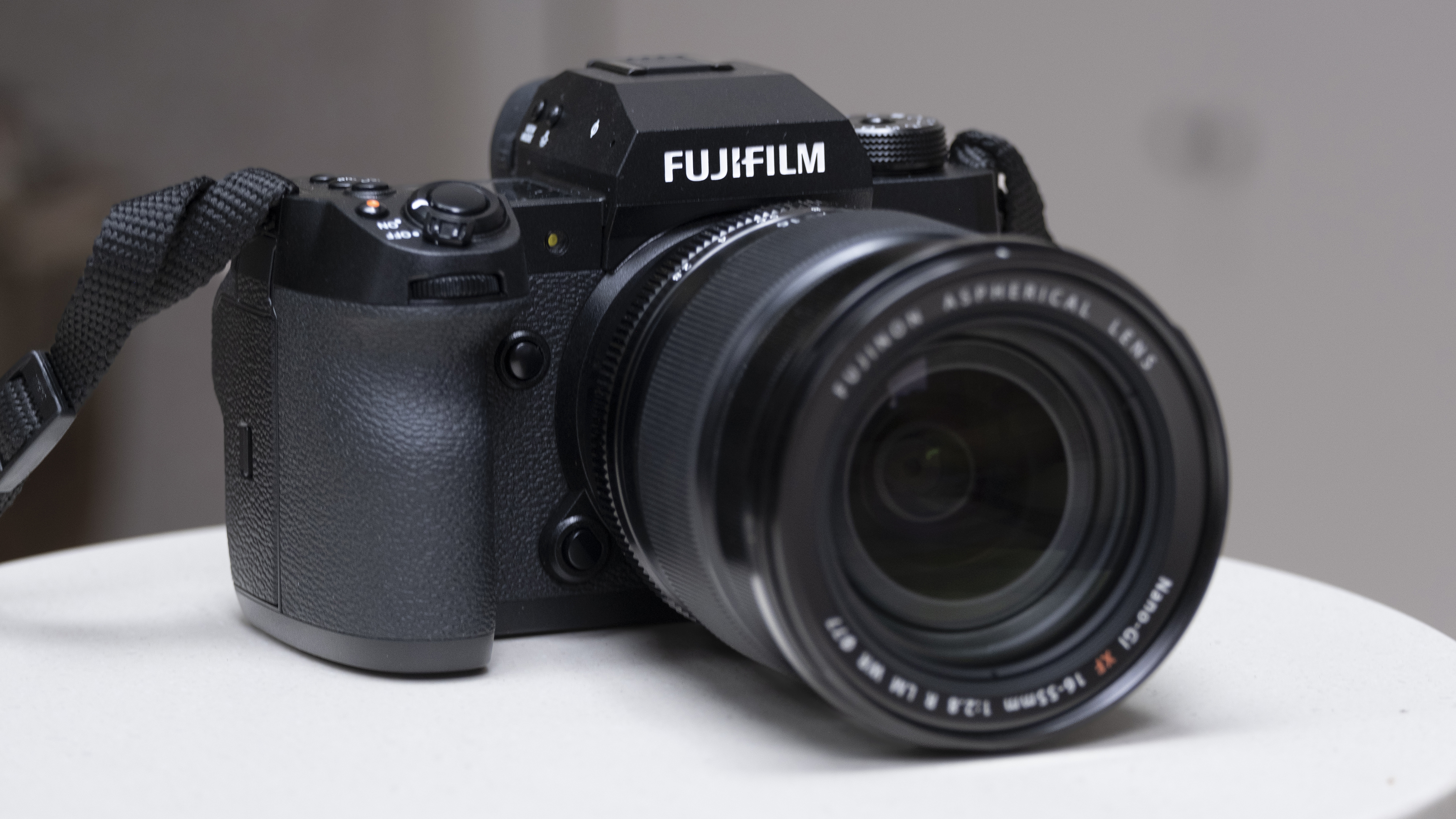 Fujifilm X-H2 camera setup on a white table