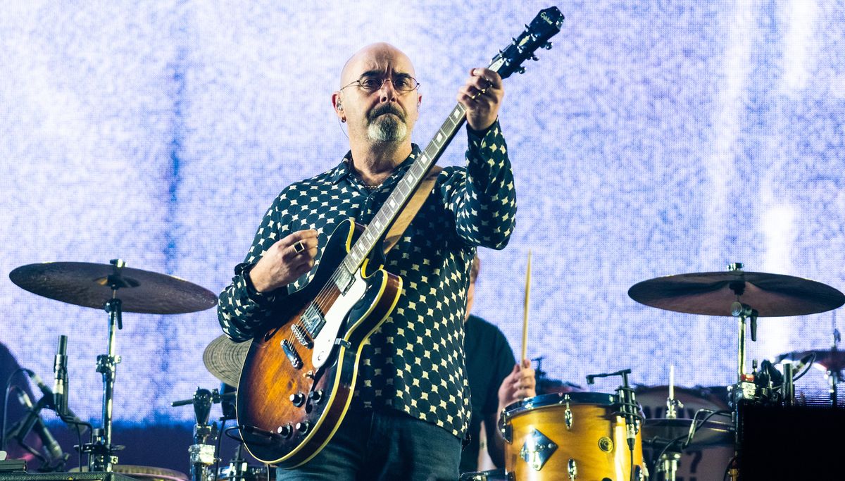 Paul &quot;Bonehead&quot; Arthurs performs with Liam Gallagher at The O2 Arena on November 28, 2019 in London