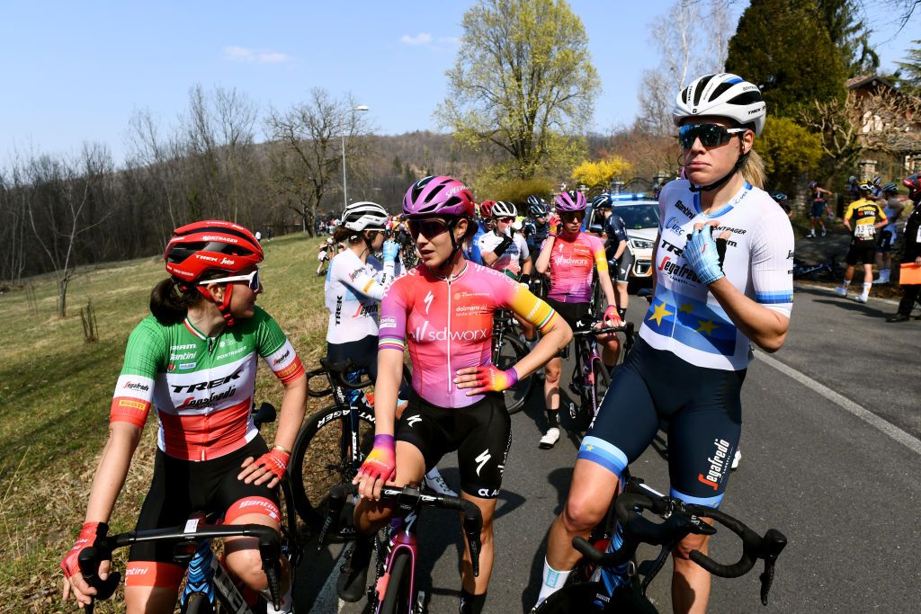 CITTIGLIO ITALY MARCH 20 LR Elisa Longo Borghini of Italy Elena Cecchini of Italy and Team SD Worx Ellen Van Dijk of Netherlands and Team Trek Segafredo Cdrine Kerbaol of France and Team Cofidis Fminin and the peloton are stopped due to the race being neutralised because of a traffic accident on the road during the 46th Trofeo Alfredo BindaComune di Cittiglio 2021 Womens Elite a 1418km one day race from Cocquio Trevisago to Cittiglio TrBinda UCIWWT on March 20 2022 in Cittiglio Italy Photo by Tim de WaeleGetty Images