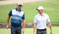 Padraig Harrington and Rory McIlroy chat on the green