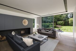 large open plan sitting area with modern fireplace design