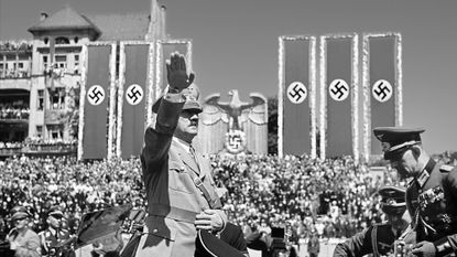 Hitler saluting troops of the Condor Legion, German volunteers who fought alongside General Franco&#039;s Nationalists in the Spanish civil war