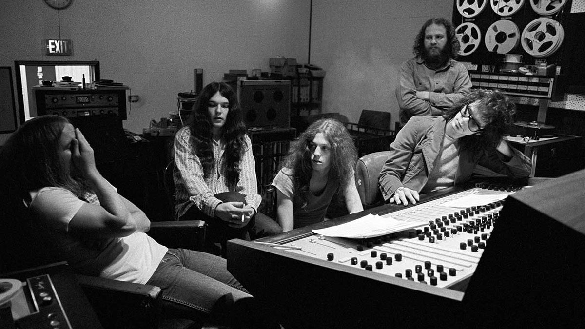 Lynyrd Skynyrd members Ronnie Van Zant, Gary Rossington and Allen Collins work with producer Al Kooper on (Pronounced Lynyrd Skynyrd) with an engineer looking on