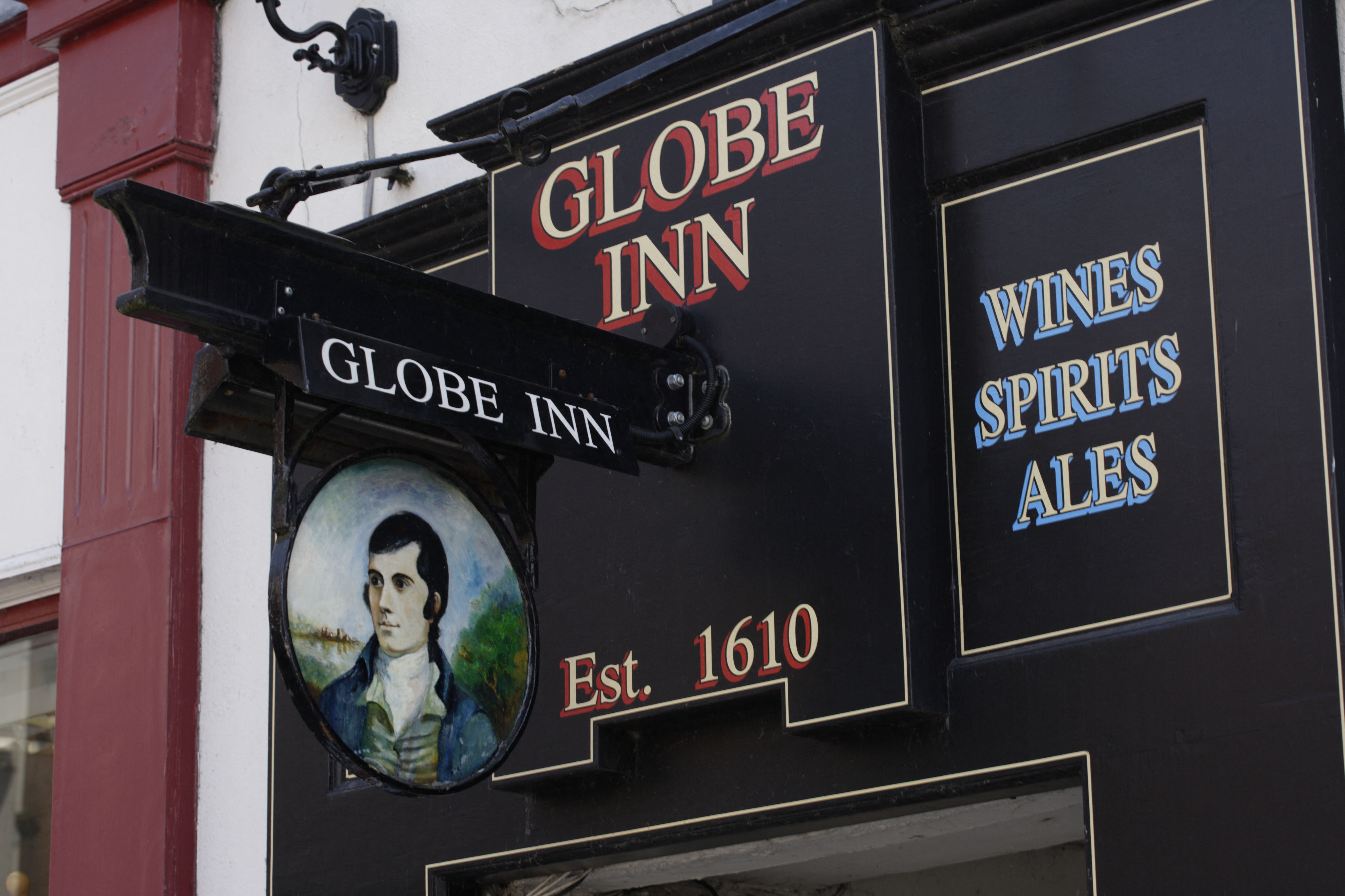 Dumfries sign outside The Globe Inn