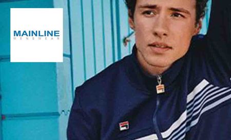 mainline logo top left with a guy posing in striped jacket in front of a paint blue shed
