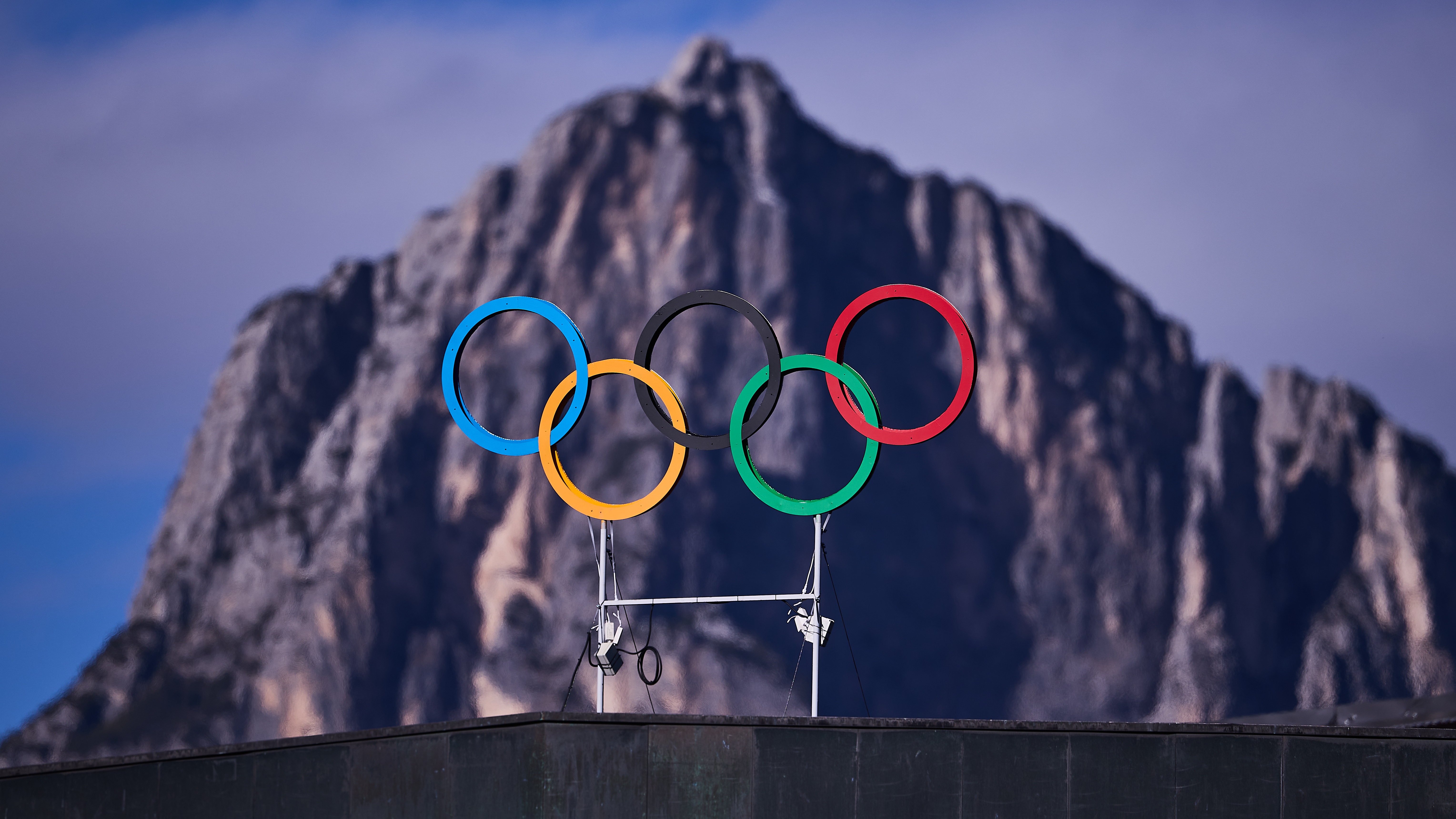 Olympics Rings are seen above the Cortina Curling Olympic Stadium ahead to the Olympic Winter Games Milano Cortina 2026 on January 23, 2026 in Cortina d'Ampezzo, Italy.