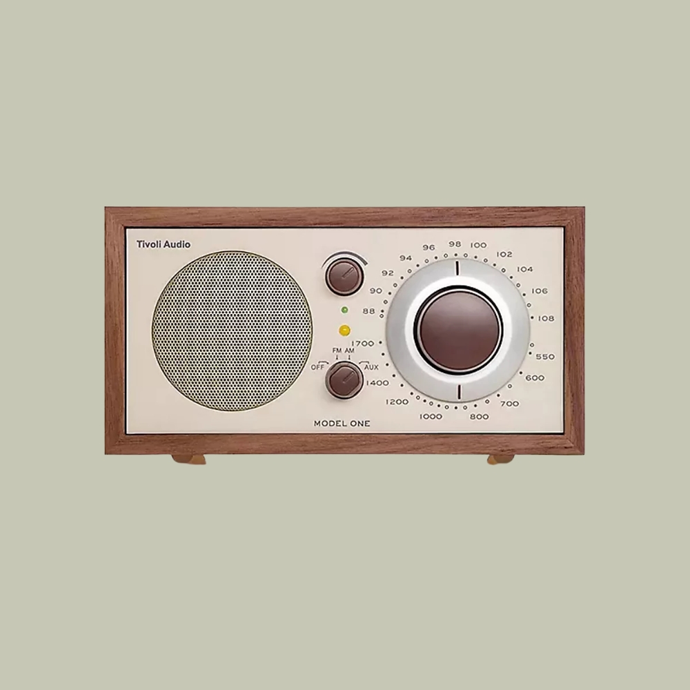 Tivoli Audio Model One AM FM Table Radio against pale green background.