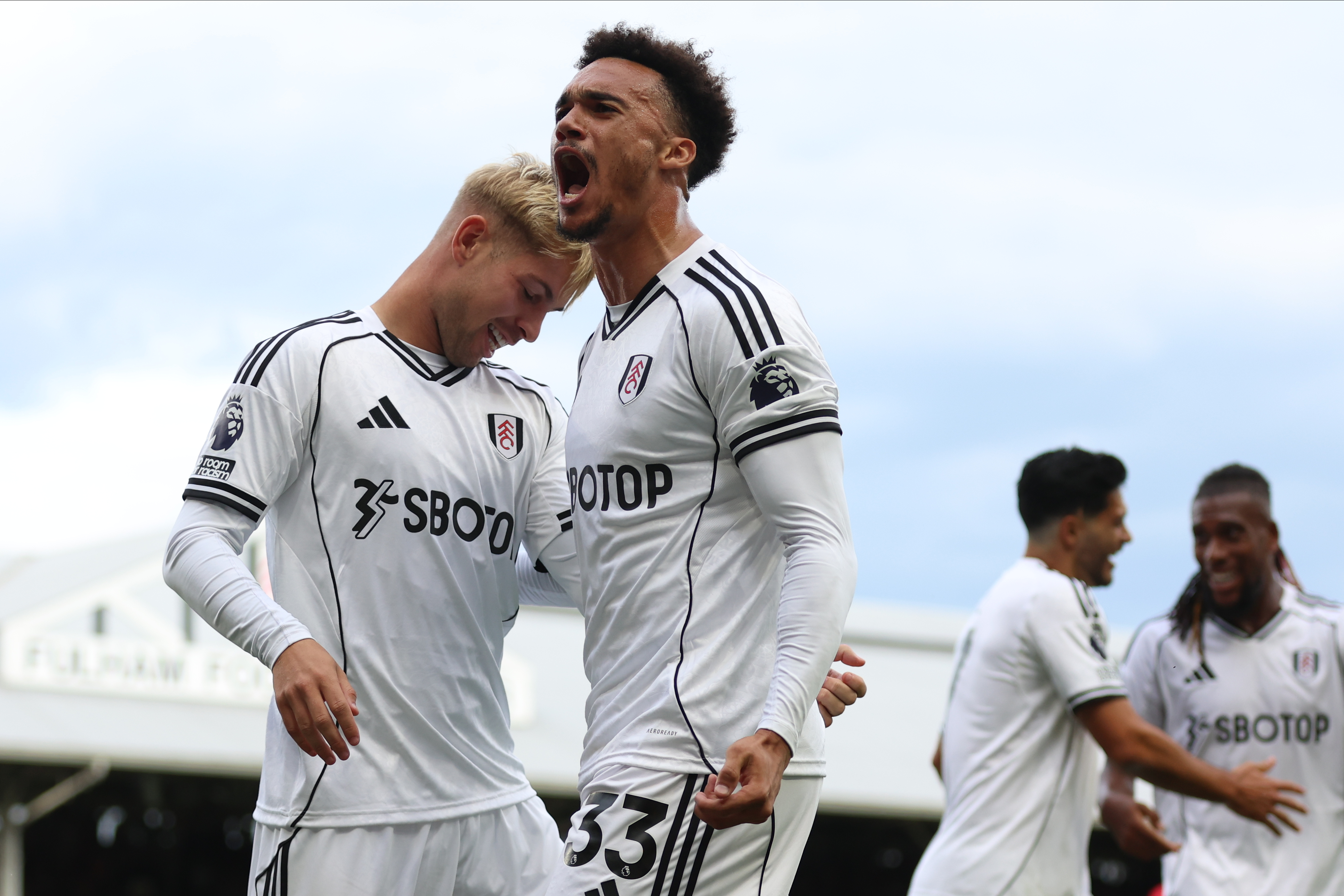 Emile Smith Rowe of Fulham and Antonee Robinson of Fulham celebrate celebrates equalizing goal during the Premier League match between Fulham and Manchester United at Craven Cottage on August 24, 2025 in London, England.
