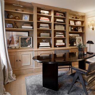 home office with built in bookshelves