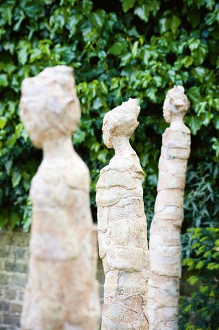 Three figures sculpture