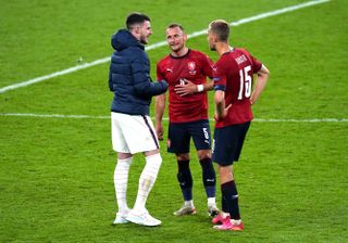 Declan Rice (left) speaks with West Ham team-mates Vladimir Coufal and Tomas Soucek