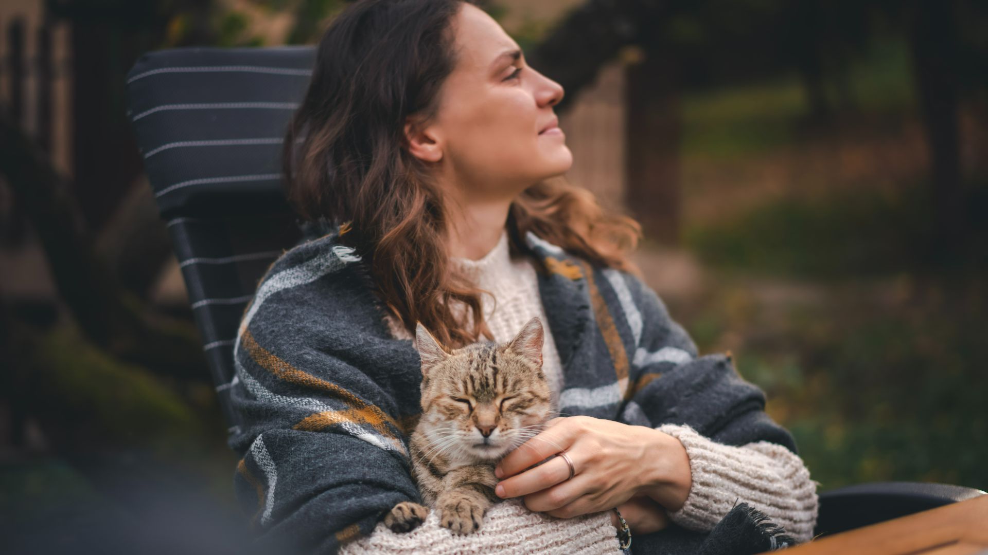 woman holding cat