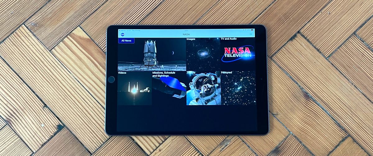 NASA app open on an ipad on wood flooring