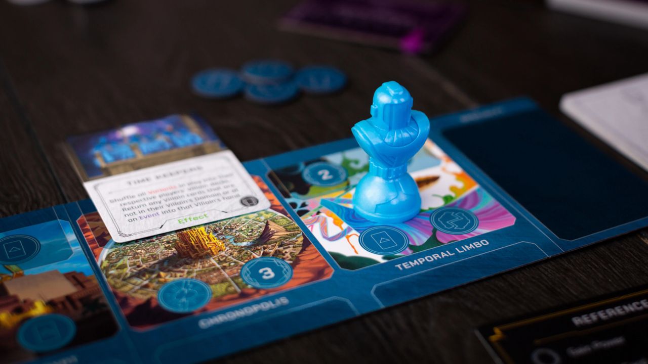 Marvel Villainous: Twisted Ambitions promotional image of Kang the Conquerer mover and board, with cards