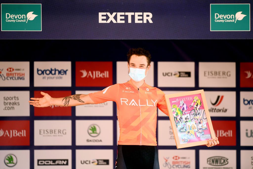 EXETER ENGLAND SEPTEMBER 06 Robin Carpenter of United States and Team Rally Cycling celebrates winning the stage on the podium ceremony after the 17th Tour of Britain 2021 Stage 2 a 1839km stage from Sherford to Exeter TourofBritain TourofBritain on September 06 2021 in Exeter England Photo by Harry TrumpGetty Images