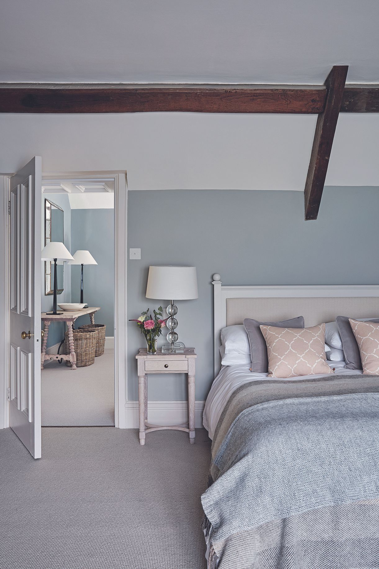 neutral bedroom with side table and bedside lamp