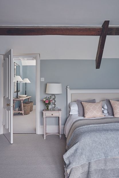 neutral bedroom with side table and bedside lamp