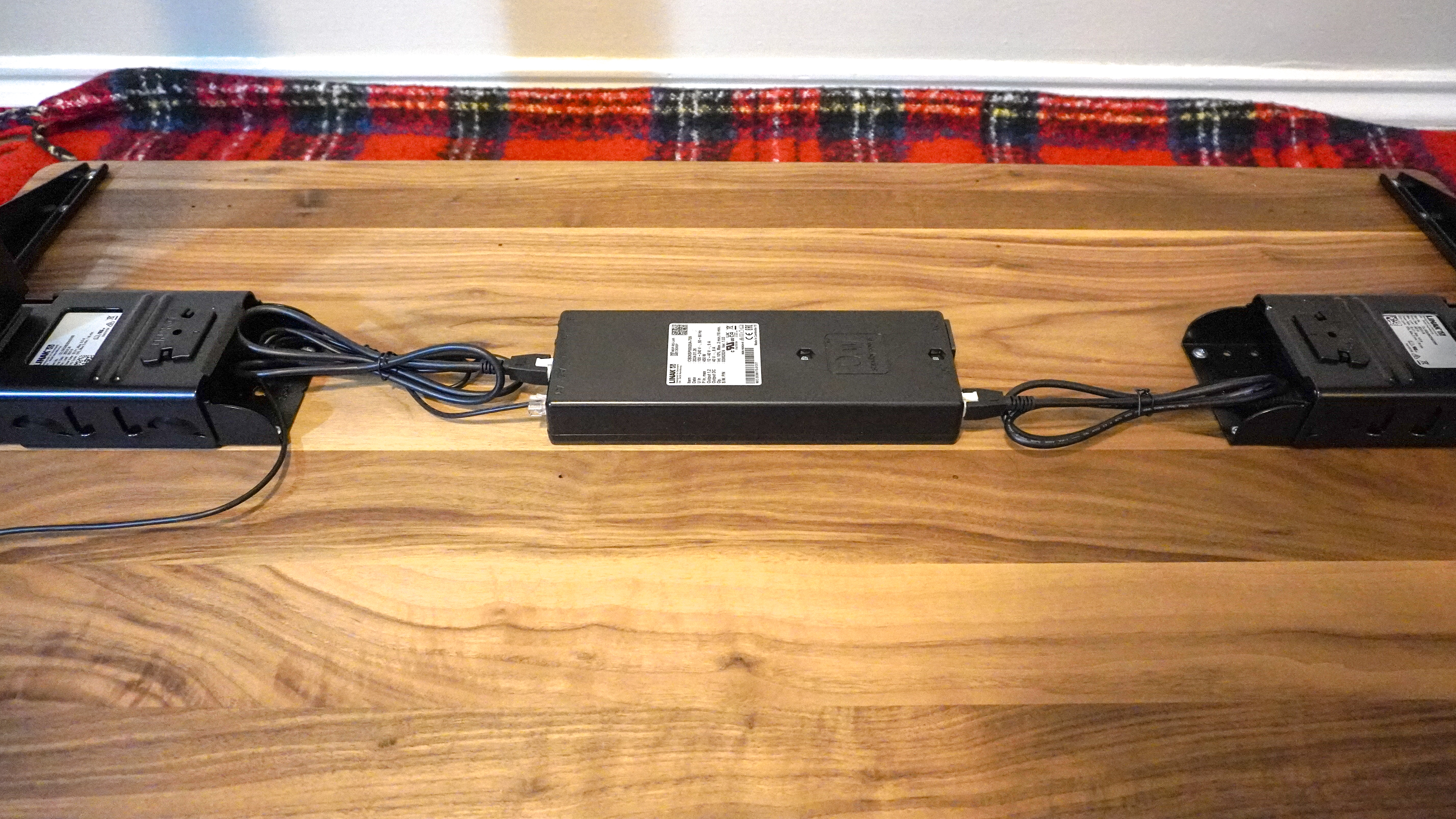 A close up shot of the Oakywood Standing Desk Pro's control box and frameless design