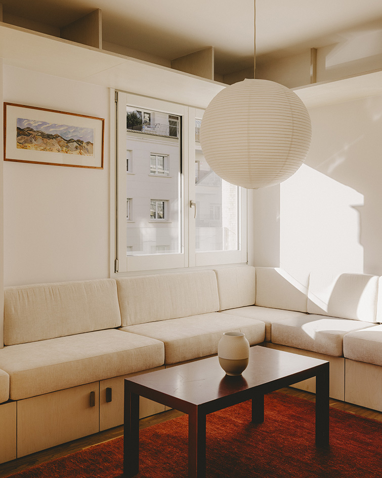 interior views of warm Barcelona apartment in red and neutral tones