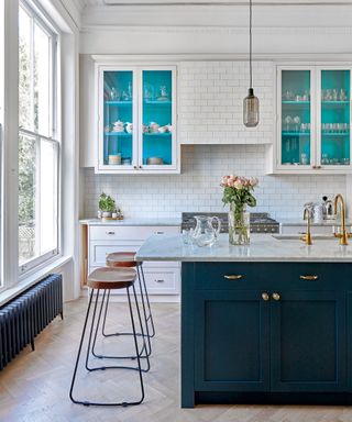 White kitchen with blue painted cabinetry