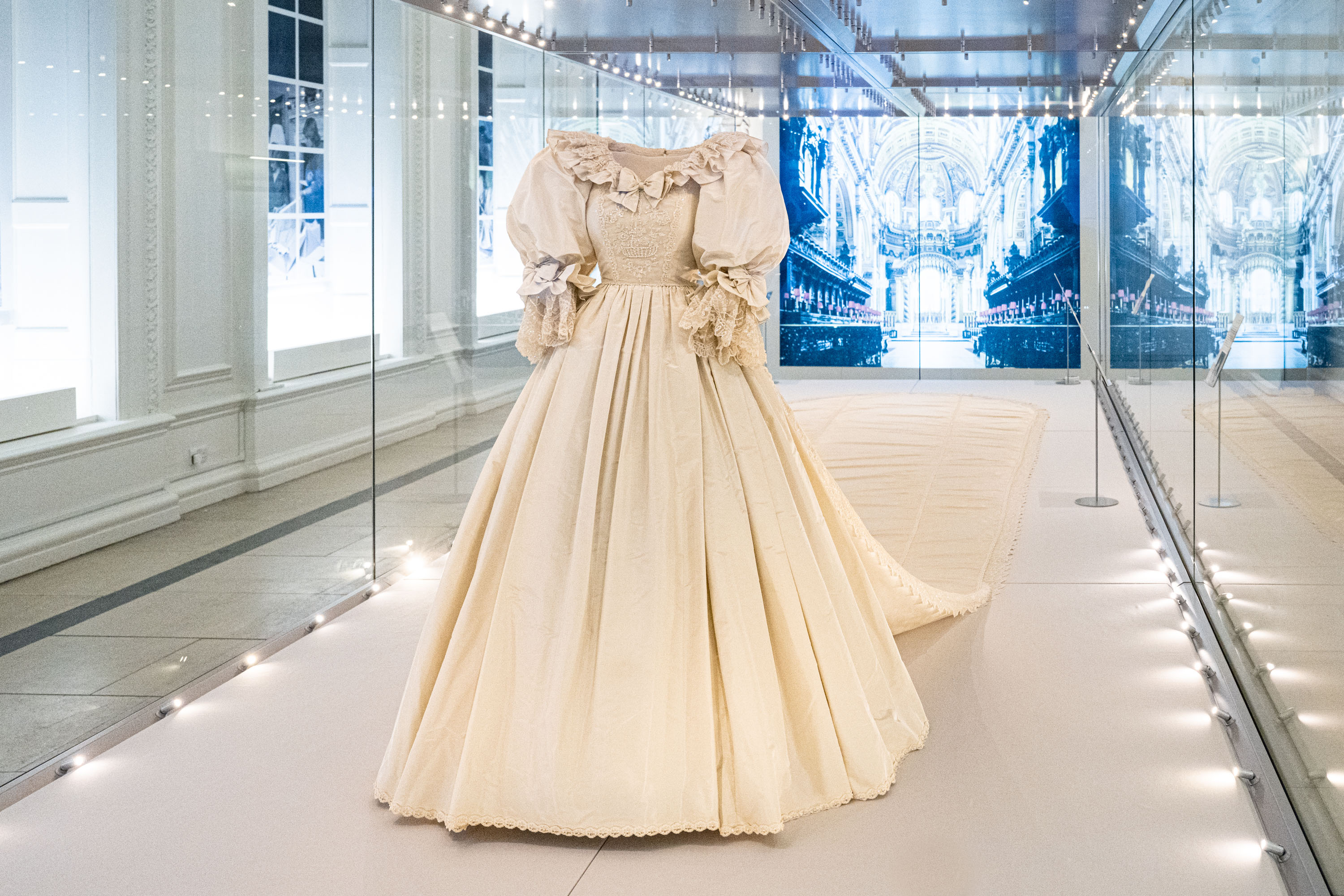 Princess Diana's wedding dress on display in a case