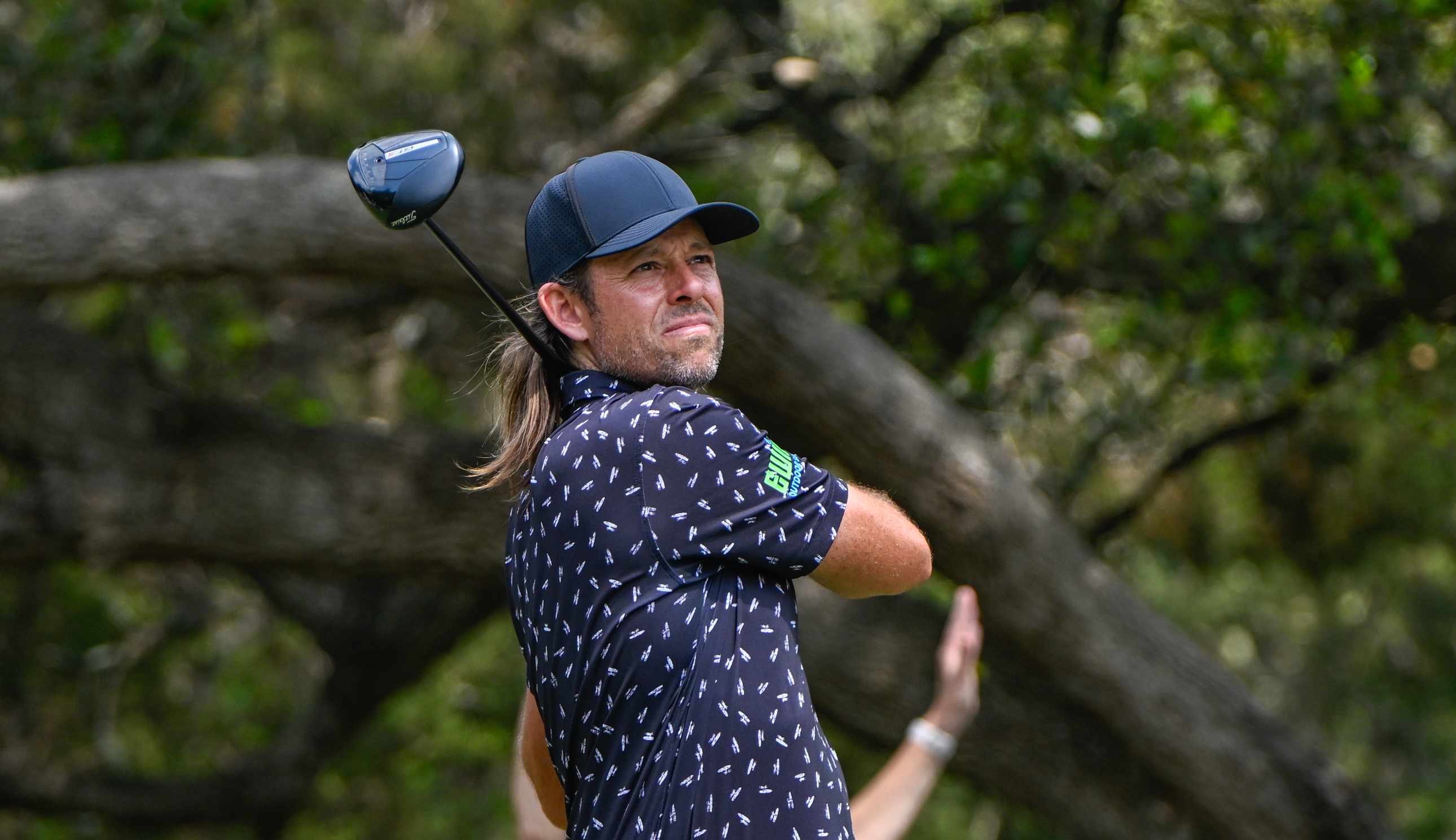 Aaron Baddeley hits a driver off the tee