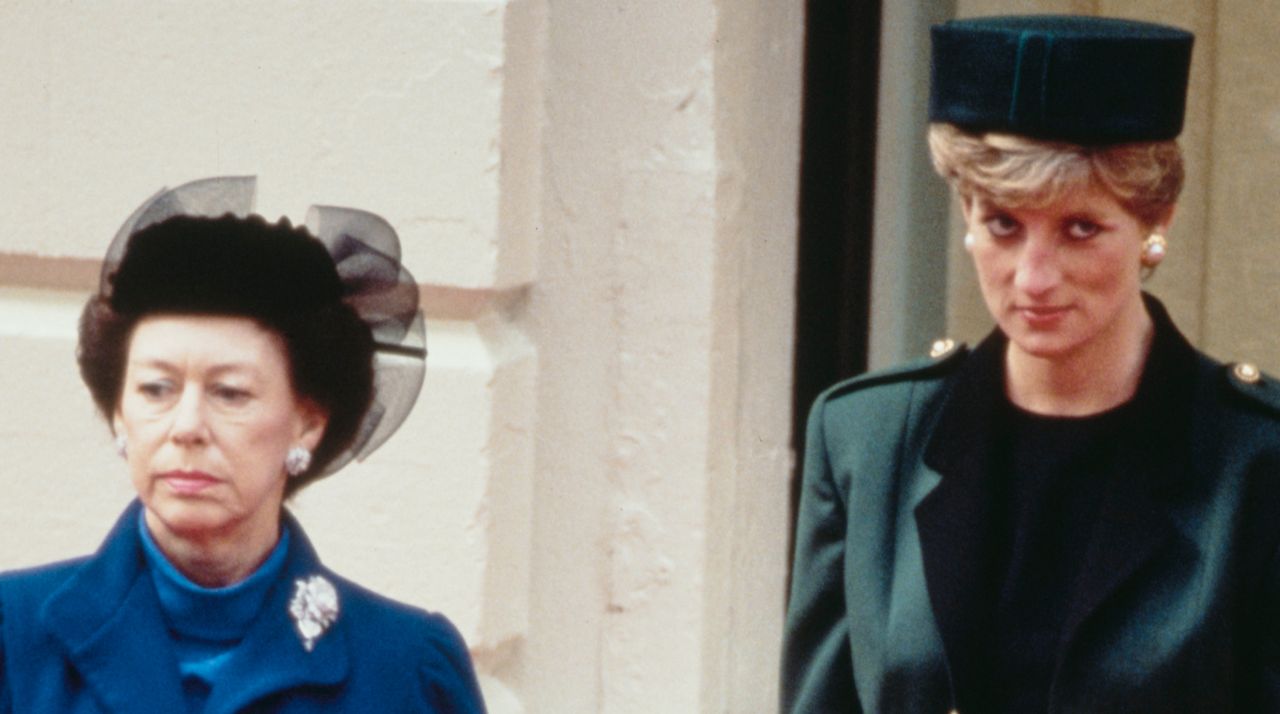 Princess Margaret wears a black hat and a blue coat while Princess Diana wears a dark green blazer with gold buttons and a matching hat