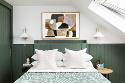 green and white bedroom with tongue and groove paneling, artwork, storage ideas, wall lights