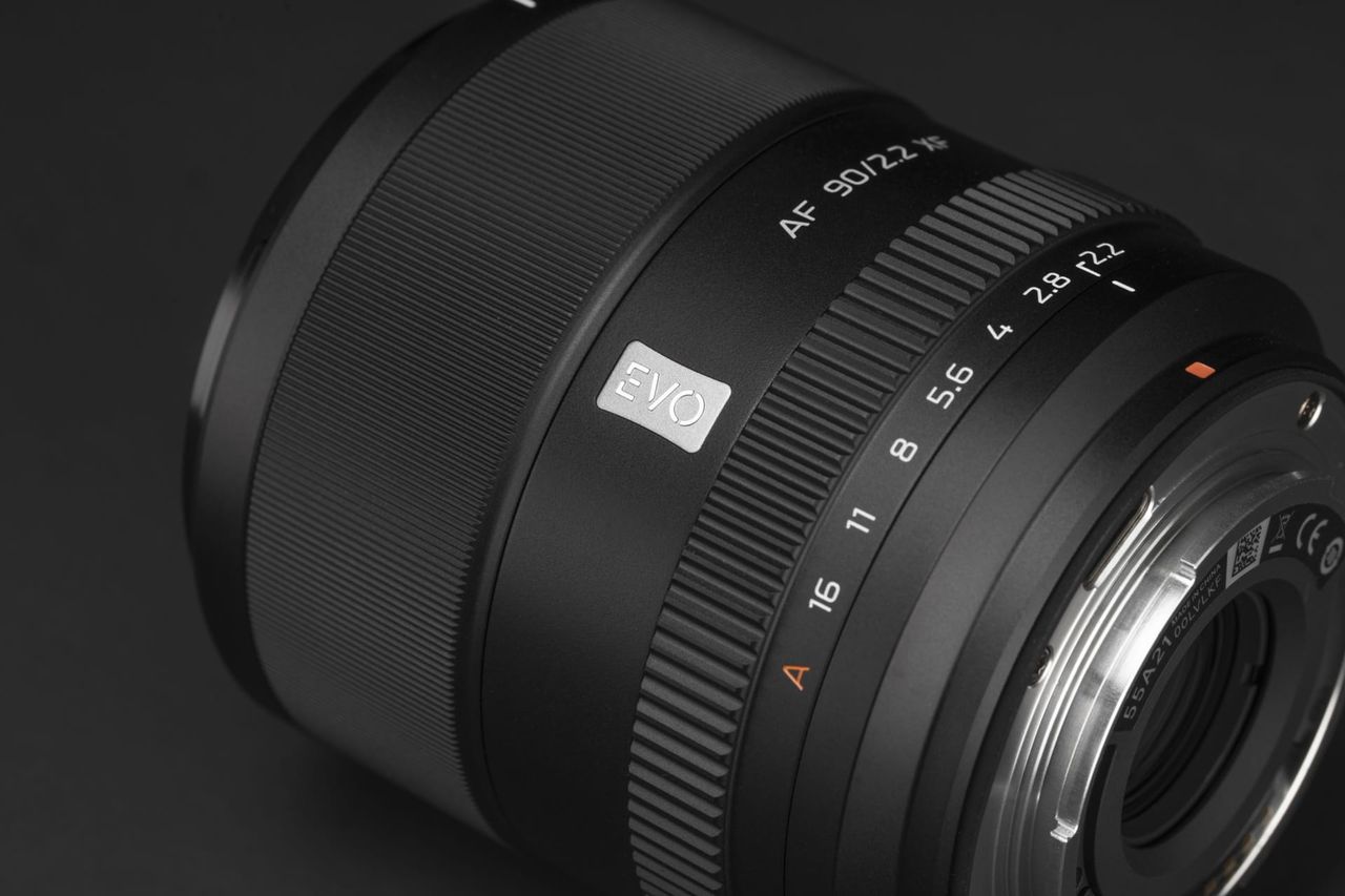 Close up of the Viltrox AF 90mm F2.2 EVO lens on a black background