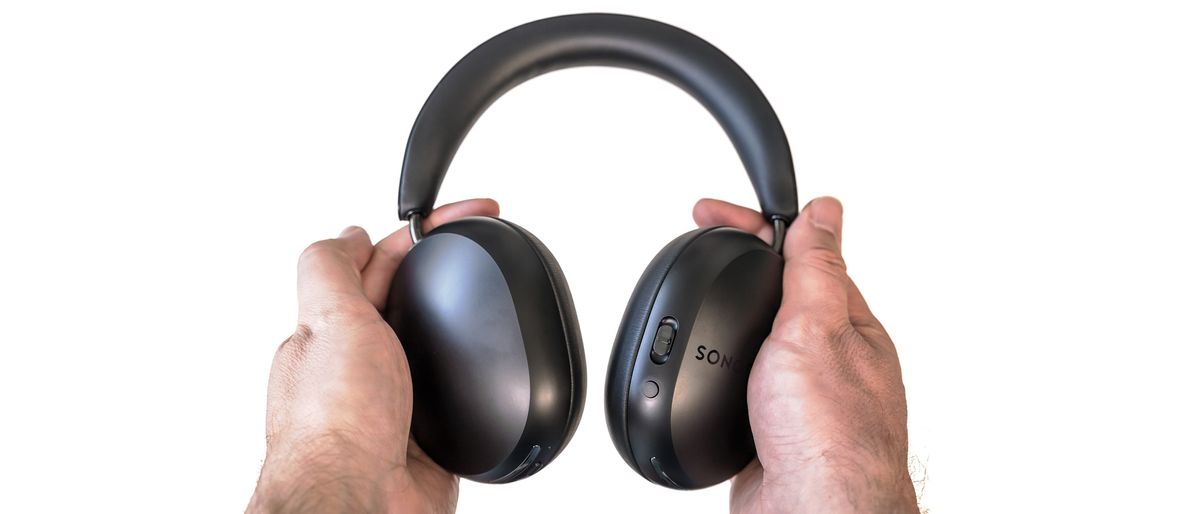 Sonos Ace headphones in black in hand.