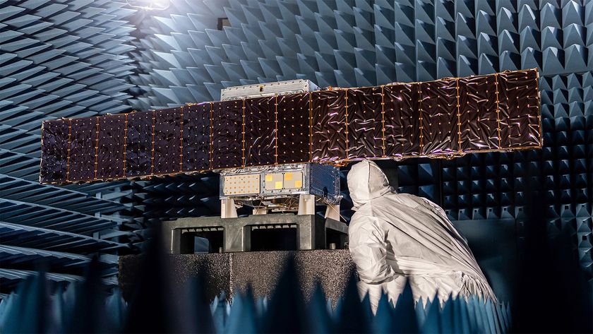 an illustration of a cube-shaped spacecraft with two wing-like solar panels
