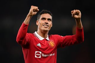 Raphael Varane of Manchester United celebrates after victory in the Premier League match between Manchester United and Liverpool FC at Old Trafford on August 22, 2022 in Manchester, England.